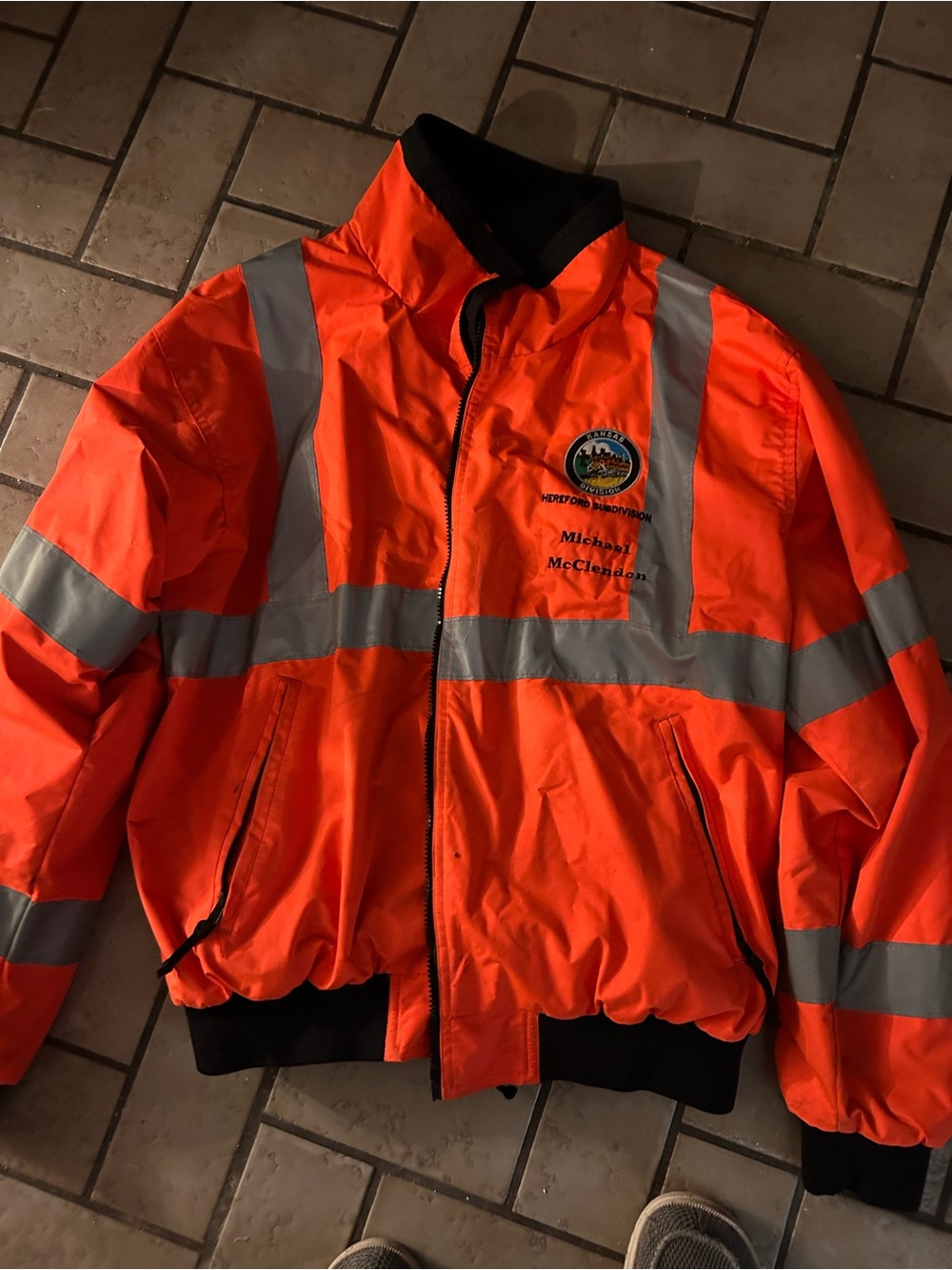 Men's High-Visibility Orange Performance Safety Jacket with Reflective Stripes